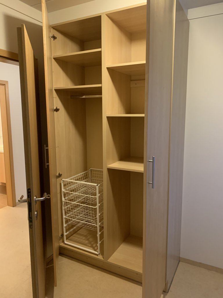 Wardrobe in the smaller room in a two-bedroom apartment