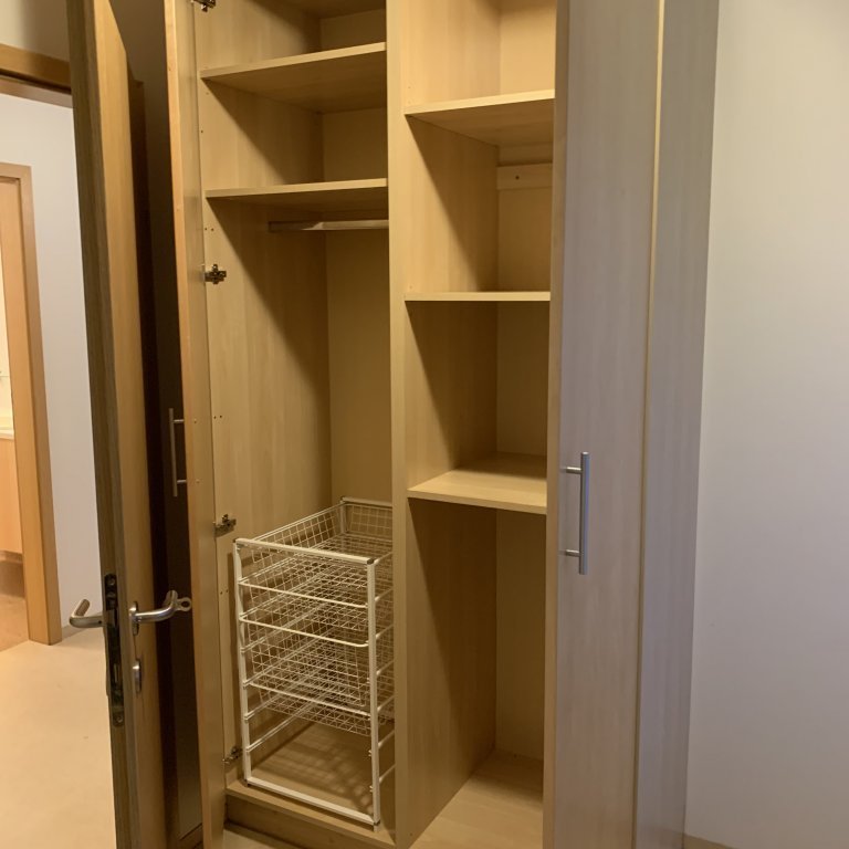 Wardrobe in the smaller room in a two-bedroom apartment