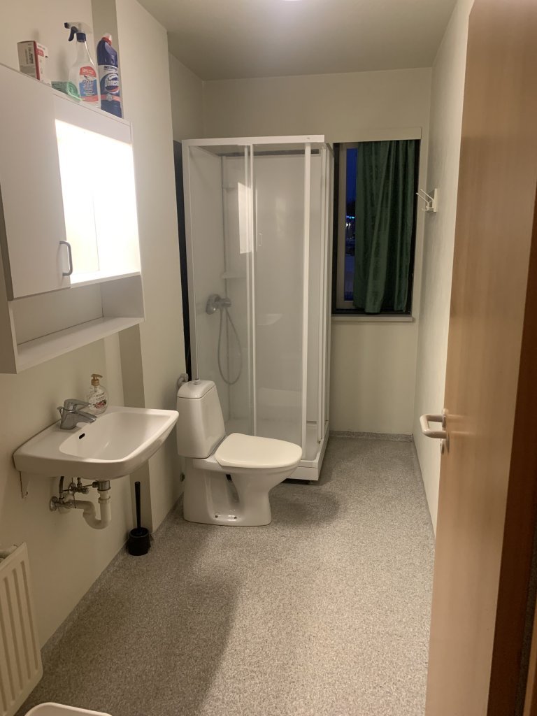 Bathroom that is shared by two rooms