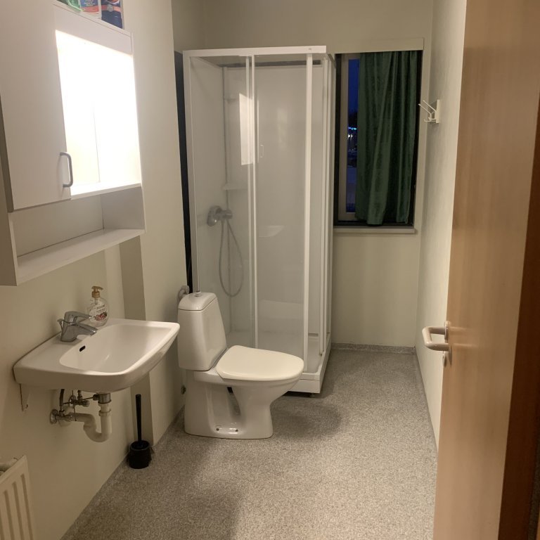 Bathroom that is shared by two rooms